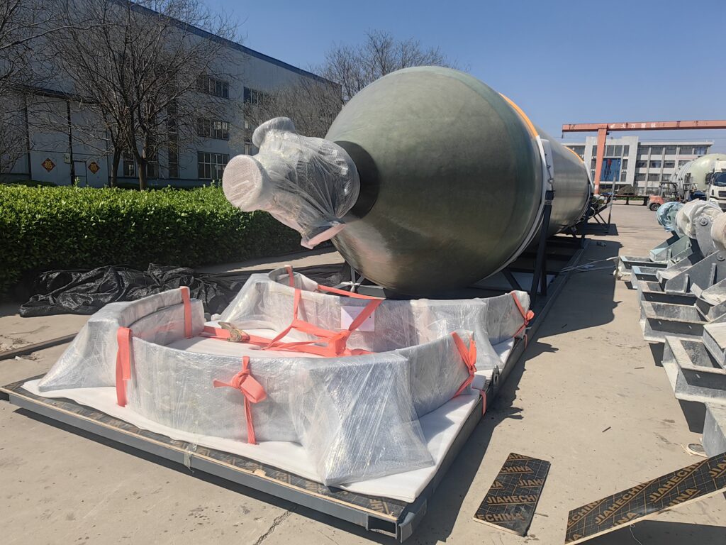 Cone bottom of an FRP acid wash vessel with loose components crated on the shipping skid