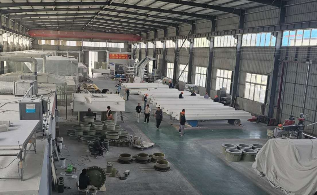 FRP floating walkway sections laid out in the fabrication shop for a pump barge system